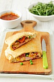 Calzone with ham, cheese, peppers and peas