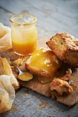 Lemon and buttermilk scones with lemon curd on a rustic wooden board