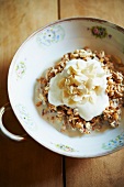 A Bowl of Muesli Topped with Yogurt and Almonds