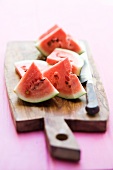 Watermelon chunks on a chopping board