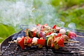 Vegetable and tofu kebabs on a rustic barbecue