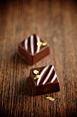 Thyme-filled chocolate squares with gold leaf