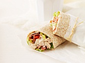 Wraps filled with chicken breast, bacon, tomatoes and lettuce