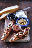 Bread topped with fig chutney, onions, feta and olives