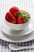 Strawberries in a porcelain teacup