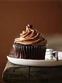 A cupcake decoration with coffee cream