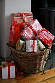 Wrapped Christmas presents in wicker basket