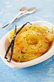 Baked pineapple slices with vanilla and lime zest