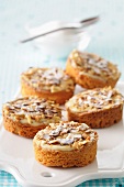 Almond tartlets with vanilla cream and icing sugar