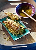 Barbecued chicken breast kebabs coated with crisp crumbs, and spicy apple sauce