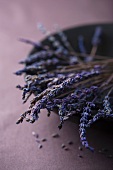 Dried lavender flowers in a black bowl