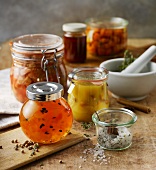 Preserving jars filled with jam, stewed fruit and the like, and assorted spices