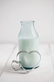 A milk bottle with heart-shaped cutters