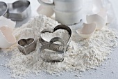 Flour, heart-shaped cutters and eggshells
