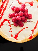 New York Cheesecake with raspberry sauce and raspberries