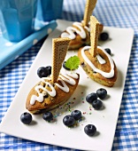 Blueberry boats with sugar glaze and wafer sails