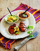 Barbecued pork medallions with two different sauces