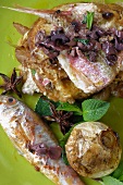 Red mullet with olives, mint, star anise and a baked onion