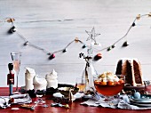 A Christmas dessert buffet with pandoro, blueberry pavlova and peach and prosecco jelly with mascarpone