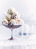 Vanilla ice cream balls with berries and a white chocolate glaze