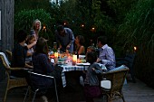 A family barbecue party on the patio in the evening