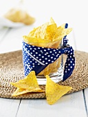 Ranch flavour tortilla chips in a glass wrapped with a spotted cloth