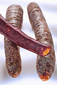 Three heritage carrots, partly peeled