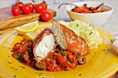 Cod wrapped in prosciutto with tomato sauce