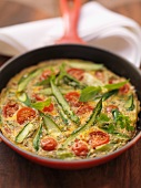 Asparagus omelette with cherry tomatoes