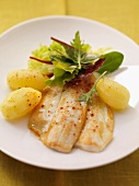 Fried plaice with boiled potatoes and salad leaves