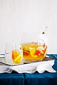 White Sangria in a Pitcher with a Wooden Spoon and In a Glass