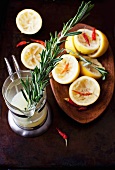 Squeezed Lemons with Rosemary and Red Chili Peppers