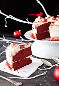 A Slice of Red Velvet Cake on a Napkin; Remainder of the Cake on a Pedestal Dish