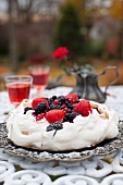 Pavlova Cake with Berries on an Outdoor Table