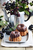 Mini Bundt cakes with rum berries and chocolate glaze