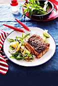 Grilled Australian barramundi fillet served with pineapple salad with basil and mint
