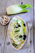 Fresh fennel with pears, black olives and toasted almonds