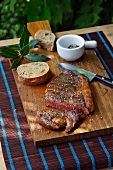 Ribeye steak with salt, pepper and bread