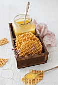 Orange and grapefruit spread with waffles in a wooden box