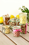Jars containing mixes for pink risotto, mushroom and potato soup, bean soup, lemon risotto and minestrone