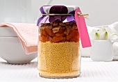 Couscous with dried apricots and walnuts, in a jar as a gift