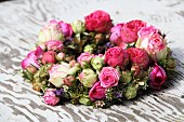 Thick wreath of flowers with pink and white roses