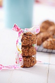 A stack of oat biscuits with a gift ribbon