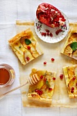 Turnip, apple and cheese toma tart with honey and pomegranat