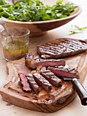 Grilled beef steak with a rocket salad