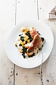 Guinea fowl wrapped in bacon with spinach