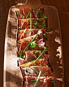Toasted slices of bread with Corsican ham and chives