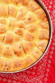 Tutmanik (Bulgarian bread with feta) in a baking tin