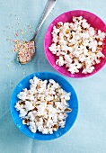 Popcorn in bowls with colourful sugar sprinkles