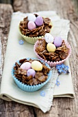 Chocolate and cornflake nests with colourful chocolate eggs